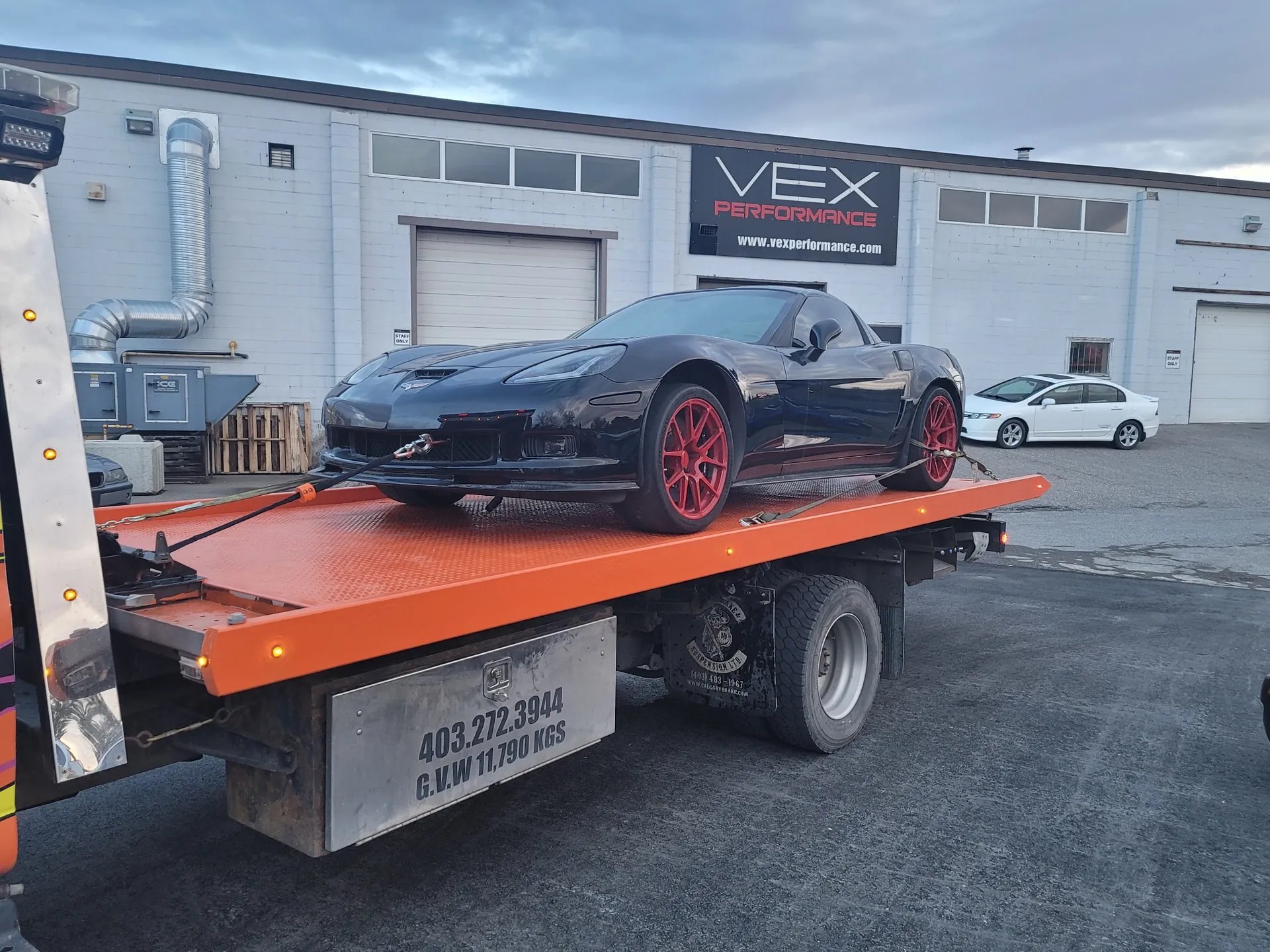 Dave's Towing transporting a Corvette in Calgary