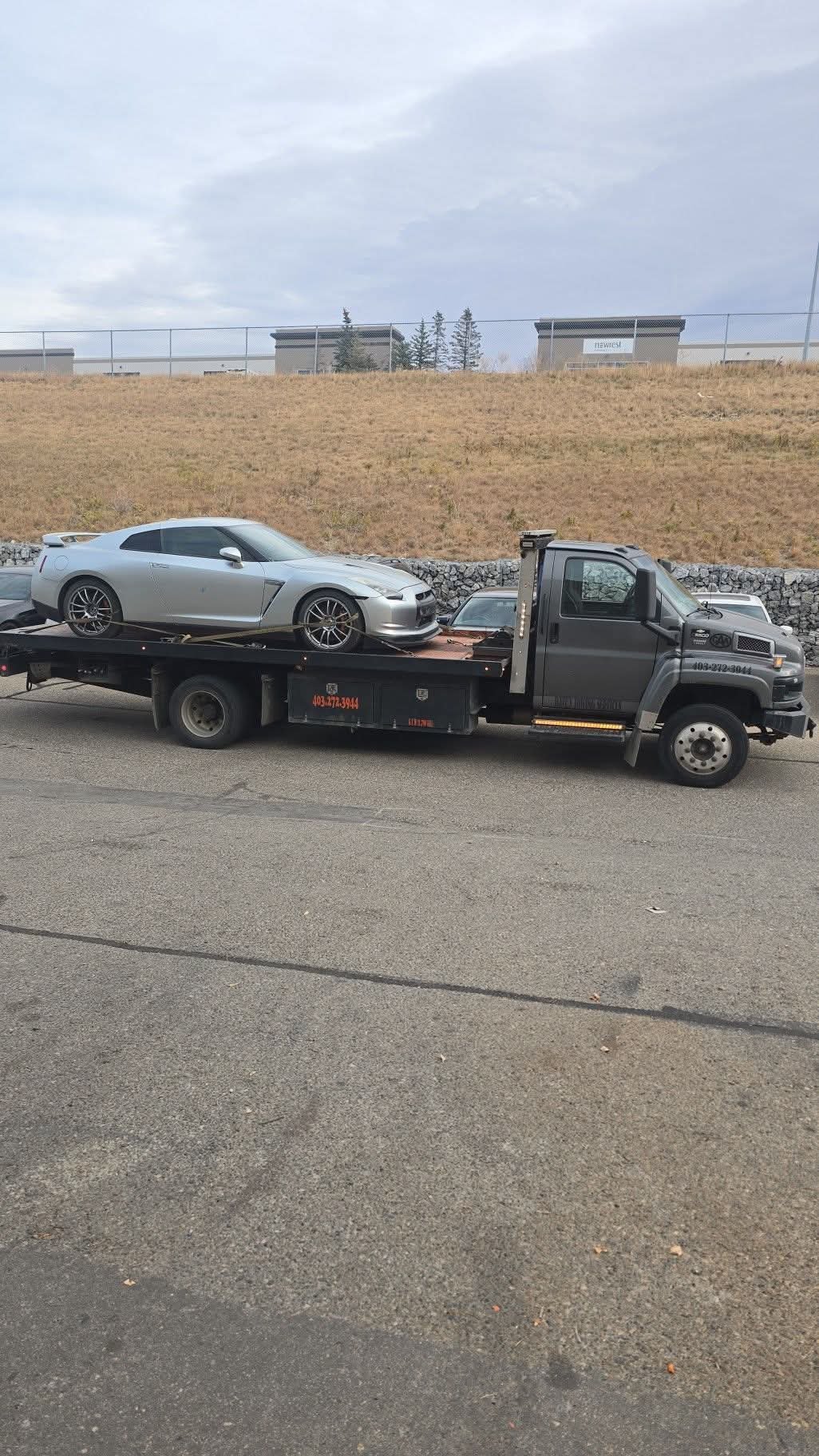 Dave's Towing: Silver Nissan GT-R Flatbed Tow in Calgary